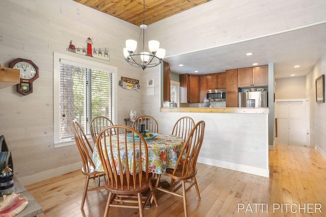618 Edgewater Dr, Spring Lake, MI 49456 - dining room featuring a chandelier, light wood-style flooring, recessed lighting, and baseboards