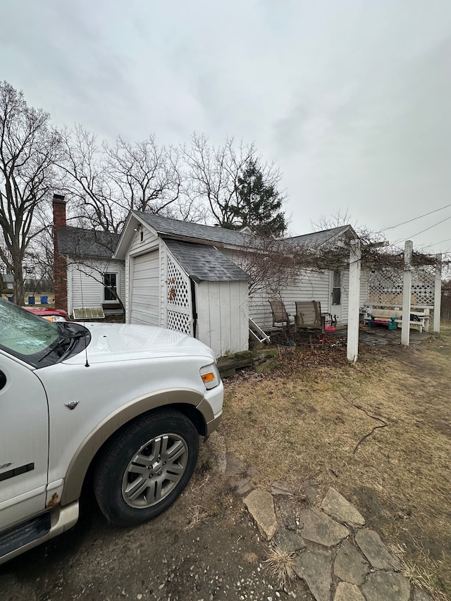 4201 Chicago Rd, Warren, MI 48092 - view of property exterior featuring an outdoor structure and a chimney