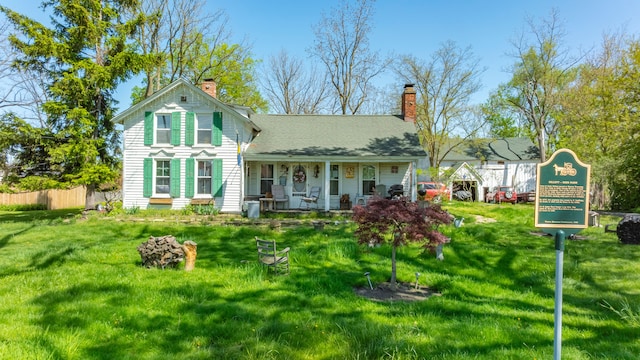 4201 Chicago Rd, Warren, MI 48092 - rear view of house with a chimney and a porch