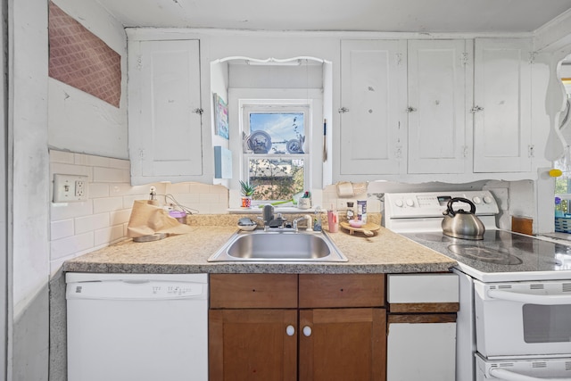 4201 Chicago Rd, Warren, MI 48092 - kitchen with white appliances, a sink, light countertops, tasteful backsplash, and white cabinets