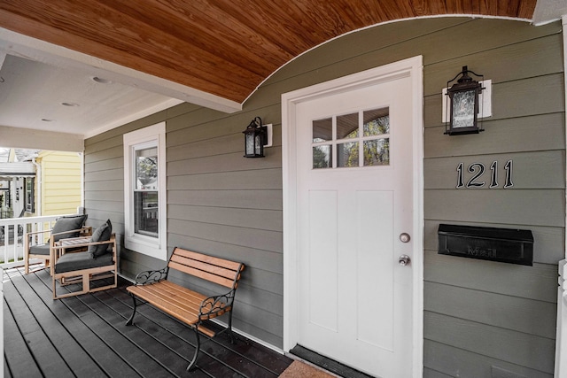 doorway to property with covered porch