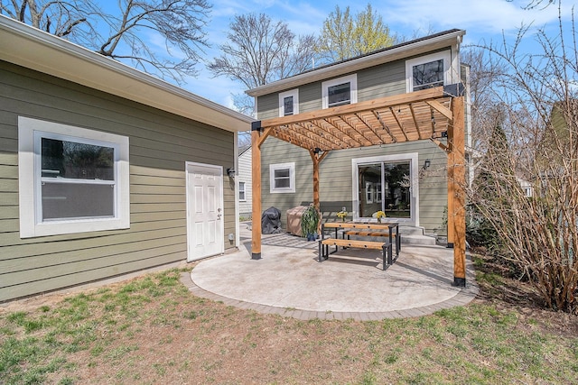 rear view of house featuring a patio area and a pergola