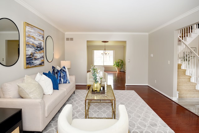 18516 Ranier Dr, Macomb, MI 48042 - living area featuring wood finished floors, crown molding, a chandelier, stairway, and baseboards