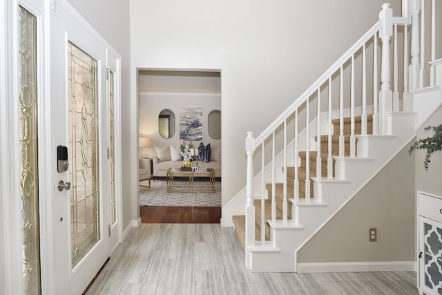 18516 Ranier Dr, Macomb, MI 48042 - foyer entrance with stairs, baseboards, and wood finished floors