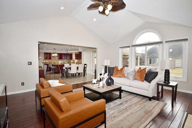 18516 Ranier Dr, Macomb, MI 48042 - living area featuring ceiling fan, wood finished floors, high vaulted ceiling, recessed lighting, and baseboards