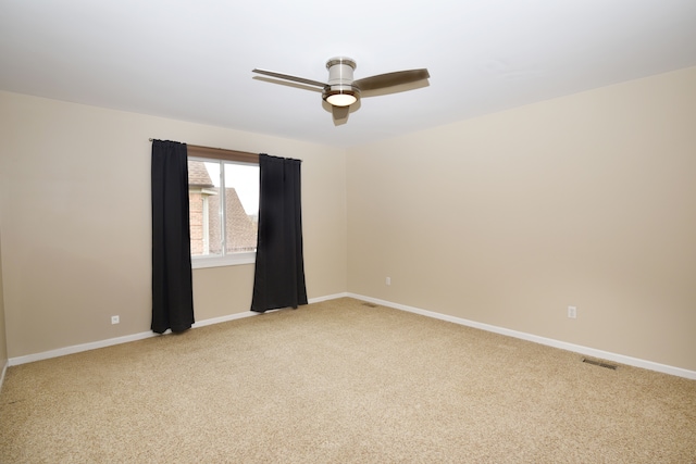 18516 Ranier Dr, Macomb, MI 48042 - empty room with light colored carpet, a ceiling fan, and baseboards
