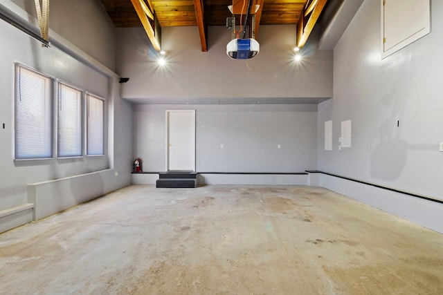 22340 Natasha Ln, South Lyon, MI 48178 - garage with a garage door opener and wooden ceiling