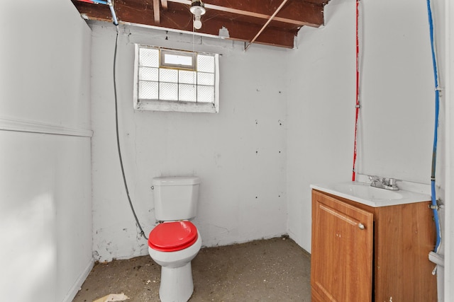 bathroom with toilet and vanity