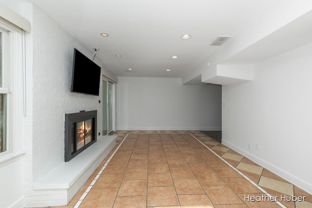 401 Stickney Ridge Rd, Grand Haven, MI 49417 - basement with recessed lighting, a large fireplace, and light tile patterned floors