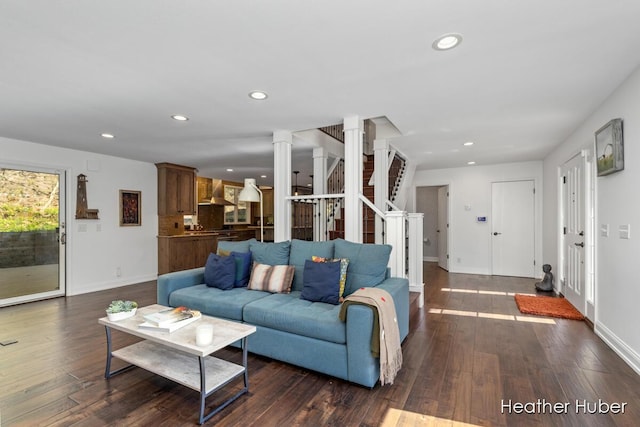 401 Stickney Ridge Rd, Grand Haven, MI 49417 - living room with decorative columns, recessed lighting, dark wood-type flooring, and stairway