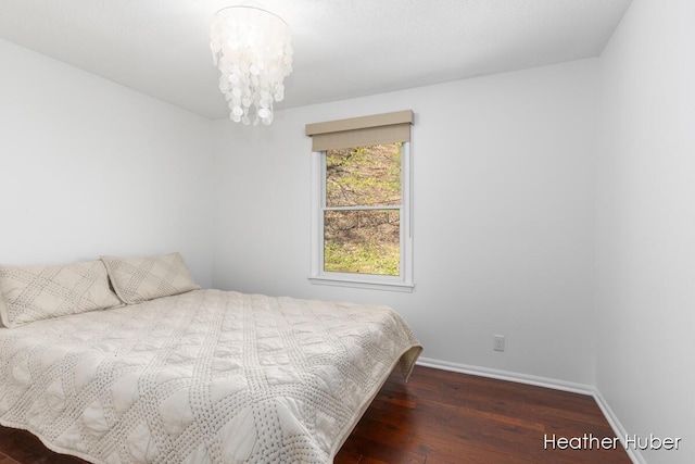 401 Stickney Ridge Rd, Grand Haven, MI 49417 - bedroom with wood finished floors and a chandelier