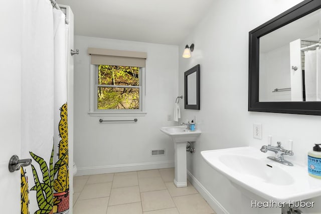 401 Stickney Ridge Rd, Grand Haven, MI 49417 - bathroom featuring a shower with shower curtain and tile patterned flooring