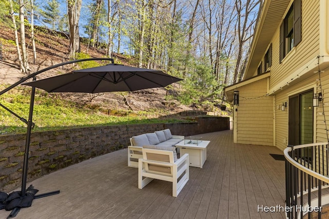 401 Stickney Ridge Rd, Grand Haven, MI 49417 - view of patio featuring a wooden deck and an outdoor living space with a fire pit