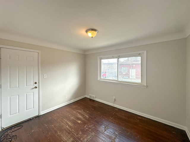 17124 Pinehurst St, Detroit, MI 48221 - empty room with baseboards and dark wood finished floors