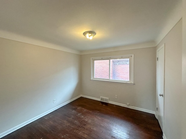 17124 Pinehurst St, Detroit, MI 48221 - empty room with dark wood-style flooring and baseboards