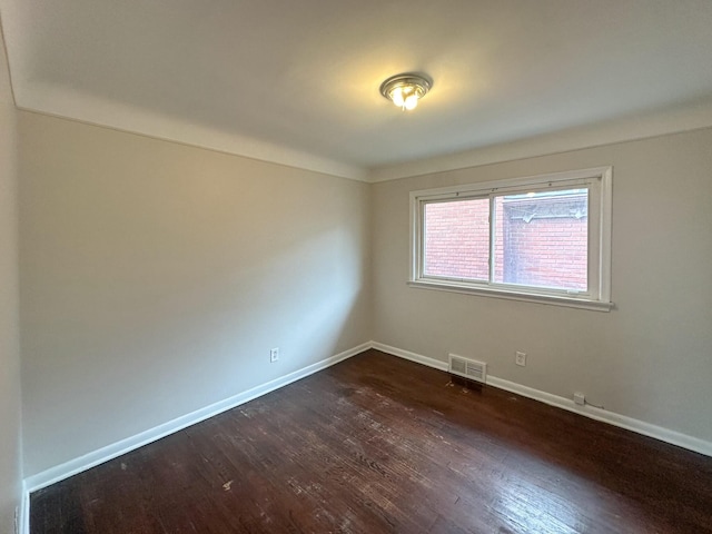 17124 Pinehurst St, Detroit, MI 48221 - spare room featuring dark wood-style floors and baseboards