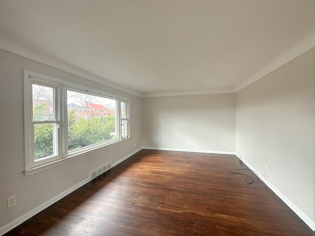17124 Pinehurst St, Detroit, MI 48221 - unfurnished room featuring dark wood-style flooring, baseboards, and ornamental molding