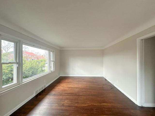 17124 Pinehurst St, Detroit, MI 48221 - empty room with dark wood finished floors, baseboards, and crown molding
