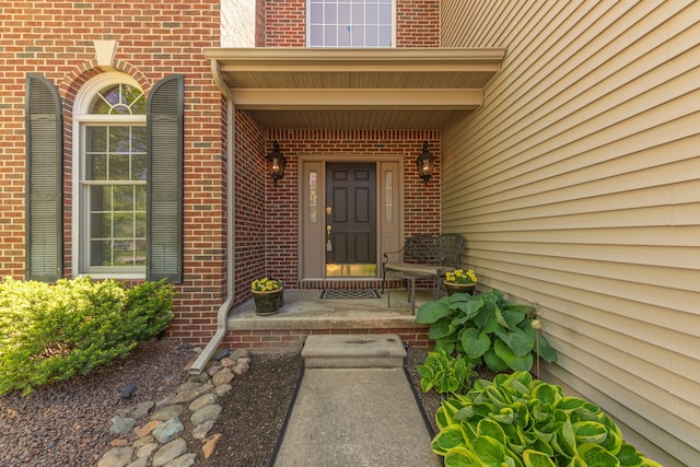 1090 Shetland Dr, South Lyon, MI 48178 - property entrance featuring brick siding and a porch