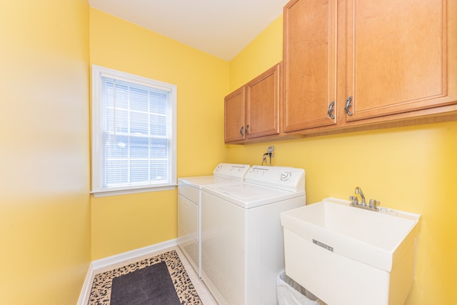 1090 Shetland Dr, South Lyon, MI 48178 - clothes washing area featuring independent washer and dryer, cabinet space, and baseboards