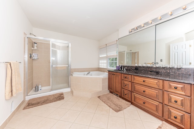 1090 Shetland Dr, South Lyon, MI 48178 - bathroom featuring tile patterned floors, a bath, a stall shower, and vanity