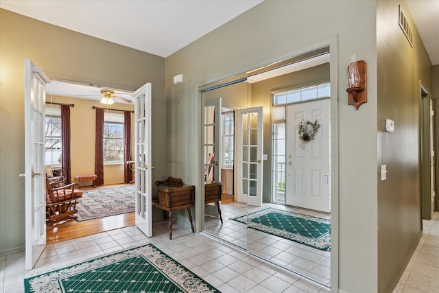 3818 Hillsdale Dr, Auburn Hills, MI 48326 - entrance foyer with french doors, light tile patterned floors, baseboards, and ceiling fan