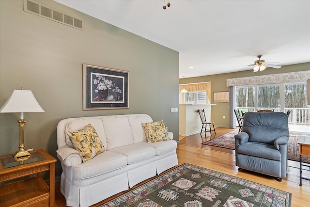 3818 Hillsdale Dr, Auburn Hills, MI 48326 - living room with wood finished floors, ceiling fan, and baseboards