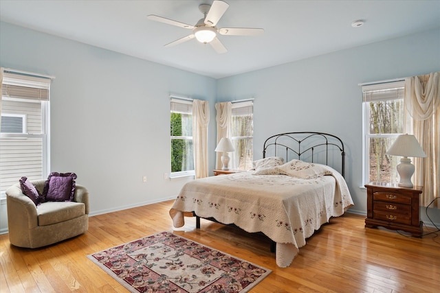 3818 Hillsdale Dr, Auburn Hills, MI 48326 - bedroom with light wood finished floors, a ceiling fan, and baseboards