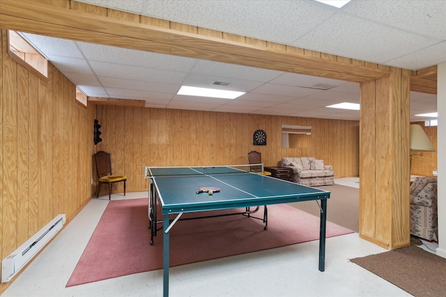 3818 Hillsdale Dr, Auburn Hills, MI 48326 - game room featuring a baseboard radiator, a drop ceiling, and wood walls