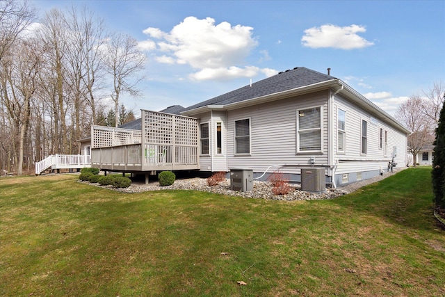 3818 Hillsdale Dr, Auburn Hills, MI 48326 - back of property with a deck, a yard, and central air condition unit