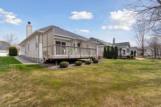 3818 Hillsdale Dr, Auburn Hills, MI 48326 - back of house with a deck, a chimney, central AC unit, and a yard