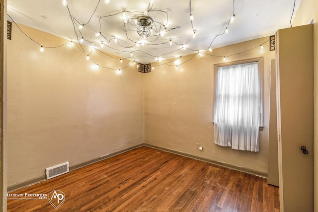 basement featuring hardwood / wood-style flooring and baseboards