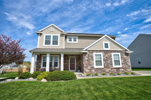 7051 Wildflower, Grand Blanc, MI 48439 - view of front of home with a front lawn and stone siding