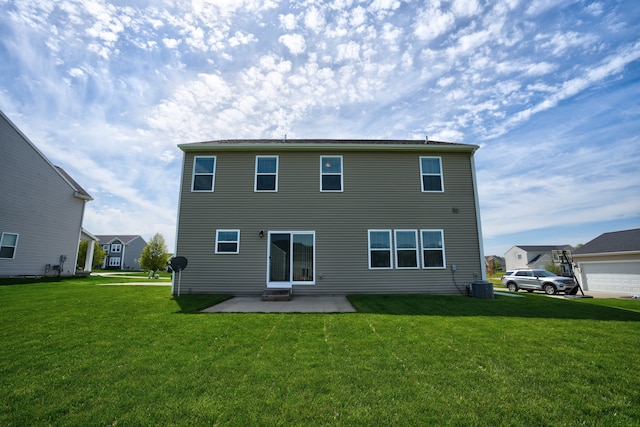 7051 Wildflower, Grand Blanc, MI 48439 - back of property featuring a lawn, central air condition unit, and a patio area
