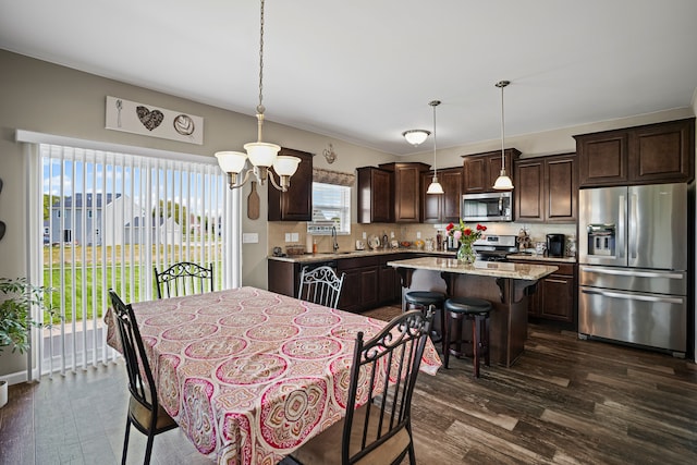 7051 Wildflower, Grand Blanc, MI 48439 - dining space featuring dark wood-style flooring and a chandelier