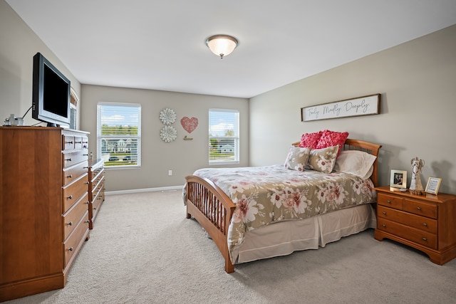 7051 Wildflower, Grand Blanc, MI 48439 - bedroom featuring light carpet and baseboards
