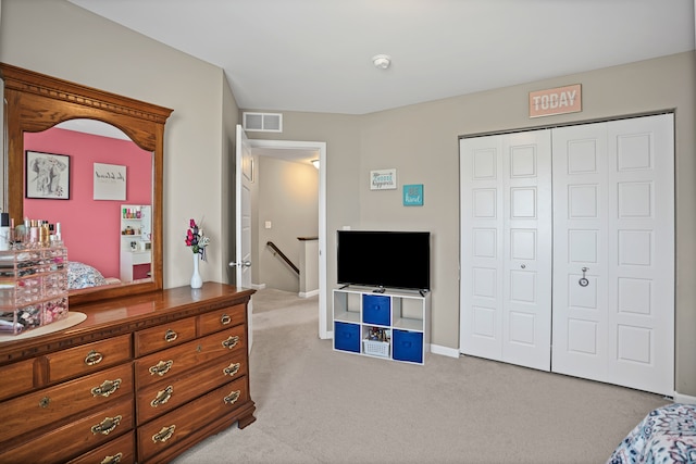 7051 Wildflower, Grand Blanc, MI 48439 - bedroom featuring carpet, a closet, and baseboards