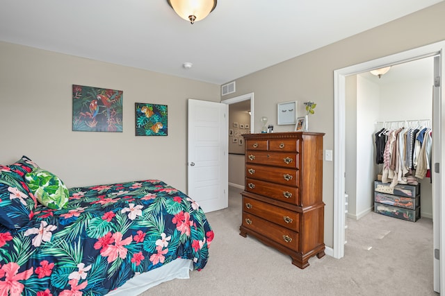 7051 Wildflower, Grand Blanc, MI 48439 - bedroom featuring light carpet and a closet