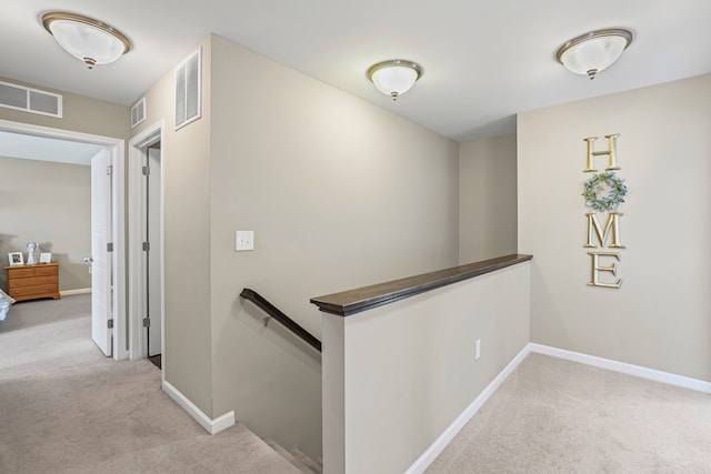7051 Wildflower, Grand Blanc, MI 48439 - hallway featuring an upstairs landing, carpet, and baseboards