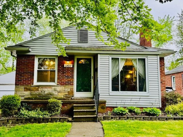 11427 Mercedes, Redford, MI 48239 - bungalow-style home featuring a chimney and entry steps