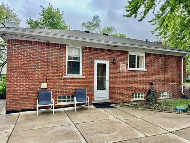 11427 Mercedes, Redford, MI 48239 - back of property with a patio area, brick siding, and central AC