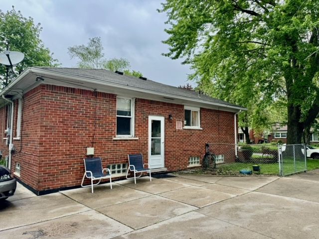 11427 Mercedes, Redford, MI 48239 - rear view of house featuring brick siding, fence, and a patio