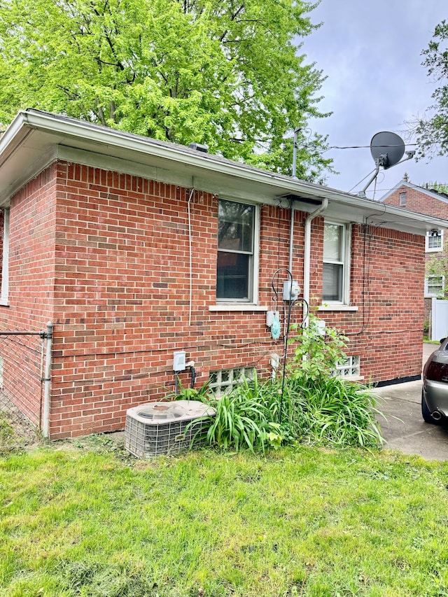11427 Mercedes, Redford, MI 48239 - view of home's exterior featuring brick siding, central AC, and a yard