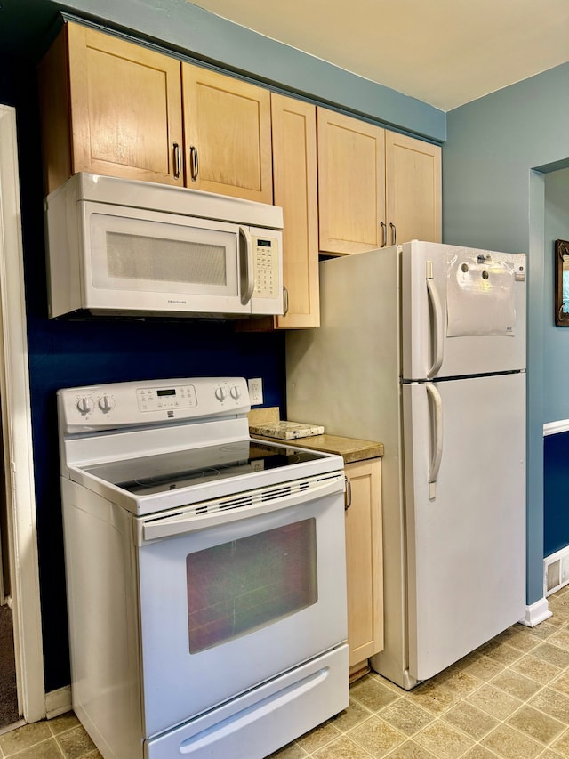 11427 Mercedes, Redford, MI 48239 - kitchen with white appliances, light brown cabinets, and light countertops