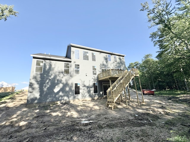 1969 Northfield Ct SW, Byron Center, MI 49315 - rear view of property featuring stairs and a wooden deck