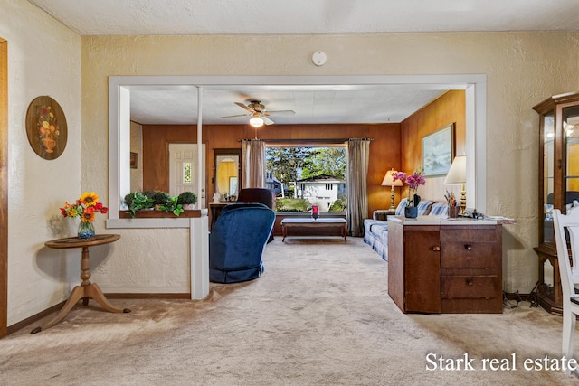 interior space with a textured wall and baseboards