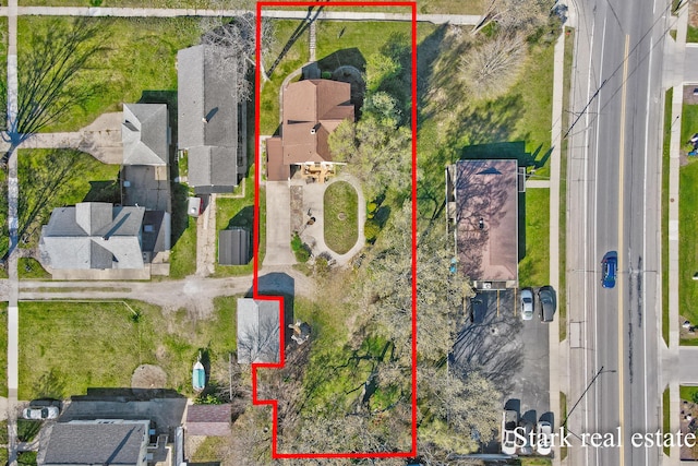 aerial view of residential area with property boundaries highlighted
