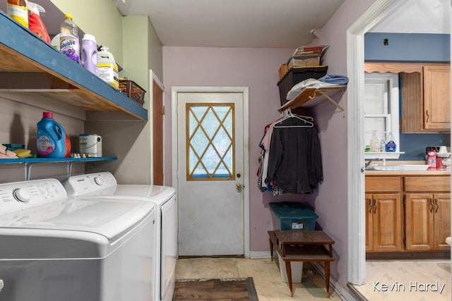 laundry area with washer and clothes dryer and plenty of natural light
