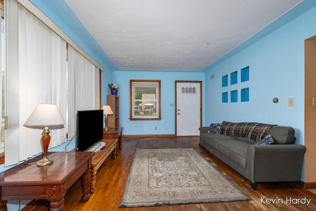 living room with wood finished floors and baseboards