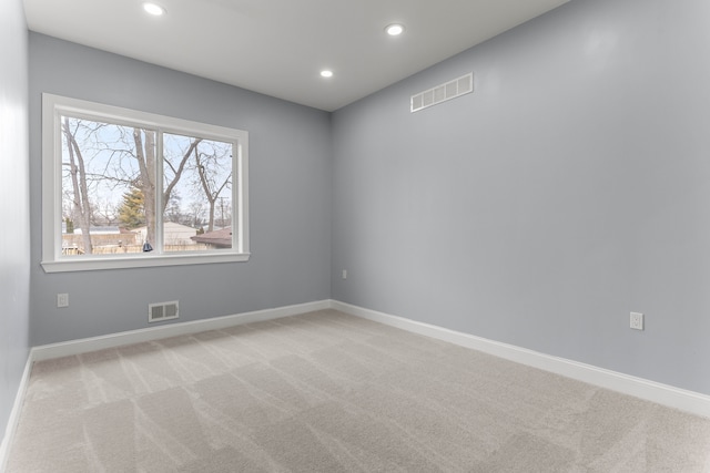 31460 James St, Garden City, MI 48135 - spare room featuring light carpet, recessed lighting, and baseboards